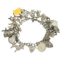 Silver charm bracelet, suspending variously aged charms