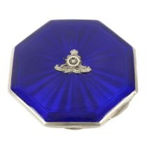 A silver and enamel compact case.