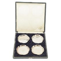 Cased set of four Japanese silver pin dishes.