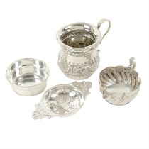 Late Victorian silver cream jug; plus an Edwardian mug & a modern silver tea strainer. (3).
