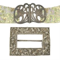 Art Nouveau silver buckle; plus a thistle embossed buckle. (2).