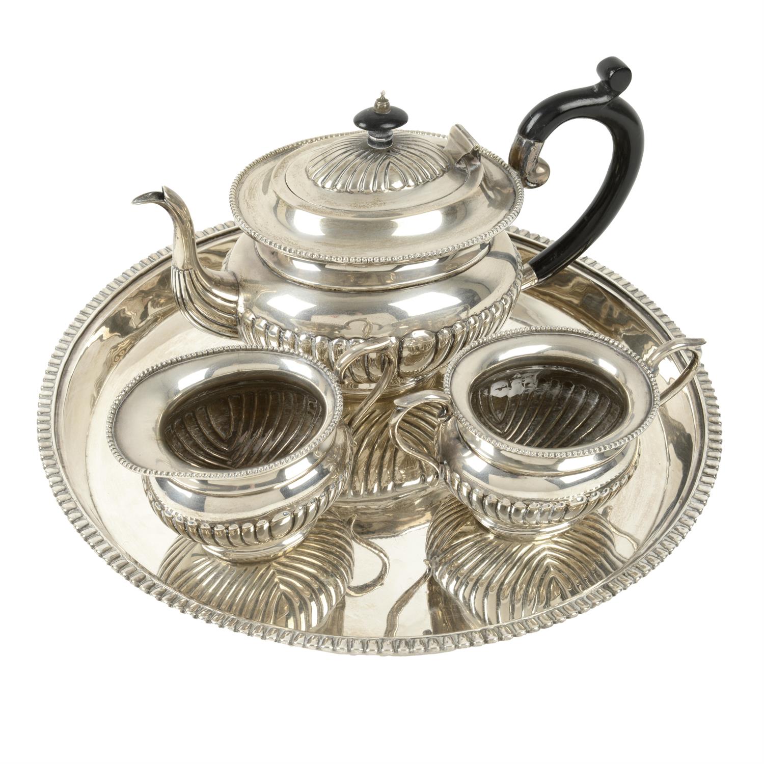 Sterling silver three piece tea set; together with a circular salver.