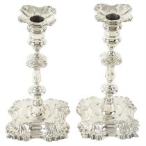 Pair of George II cast silver candlesticks.