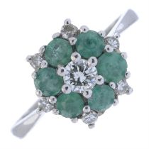 gold emerald and brilliant-cut diamond cluster ring.