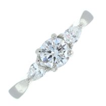 A platinum brilliant-cut and pear-shape diamond three-stone ring.