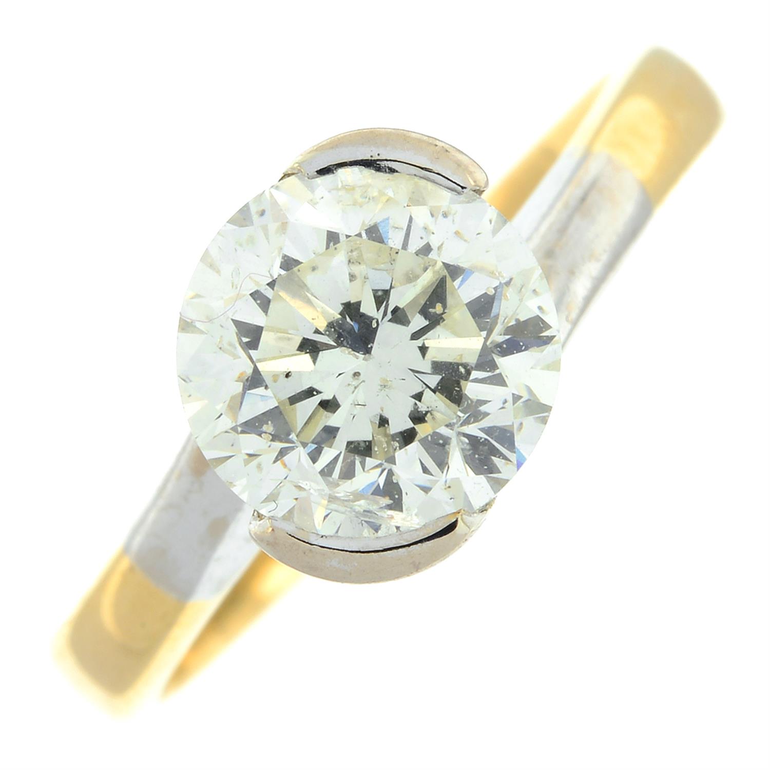 An 18ct gold brilliant-cut diamond single-stone bi-colour ring.