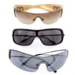 Miu Miu - three pairs of sunglasses.