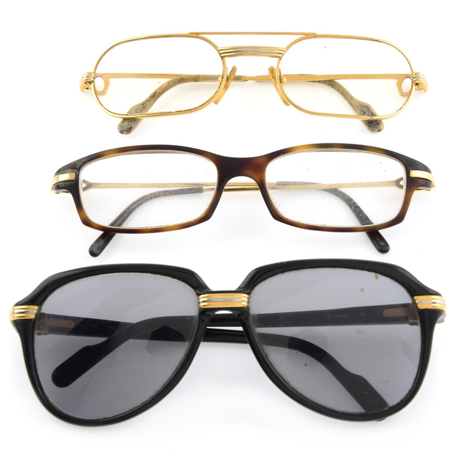 Cartier - pair of prescription sunglasses and two pairs of prescription glasses.