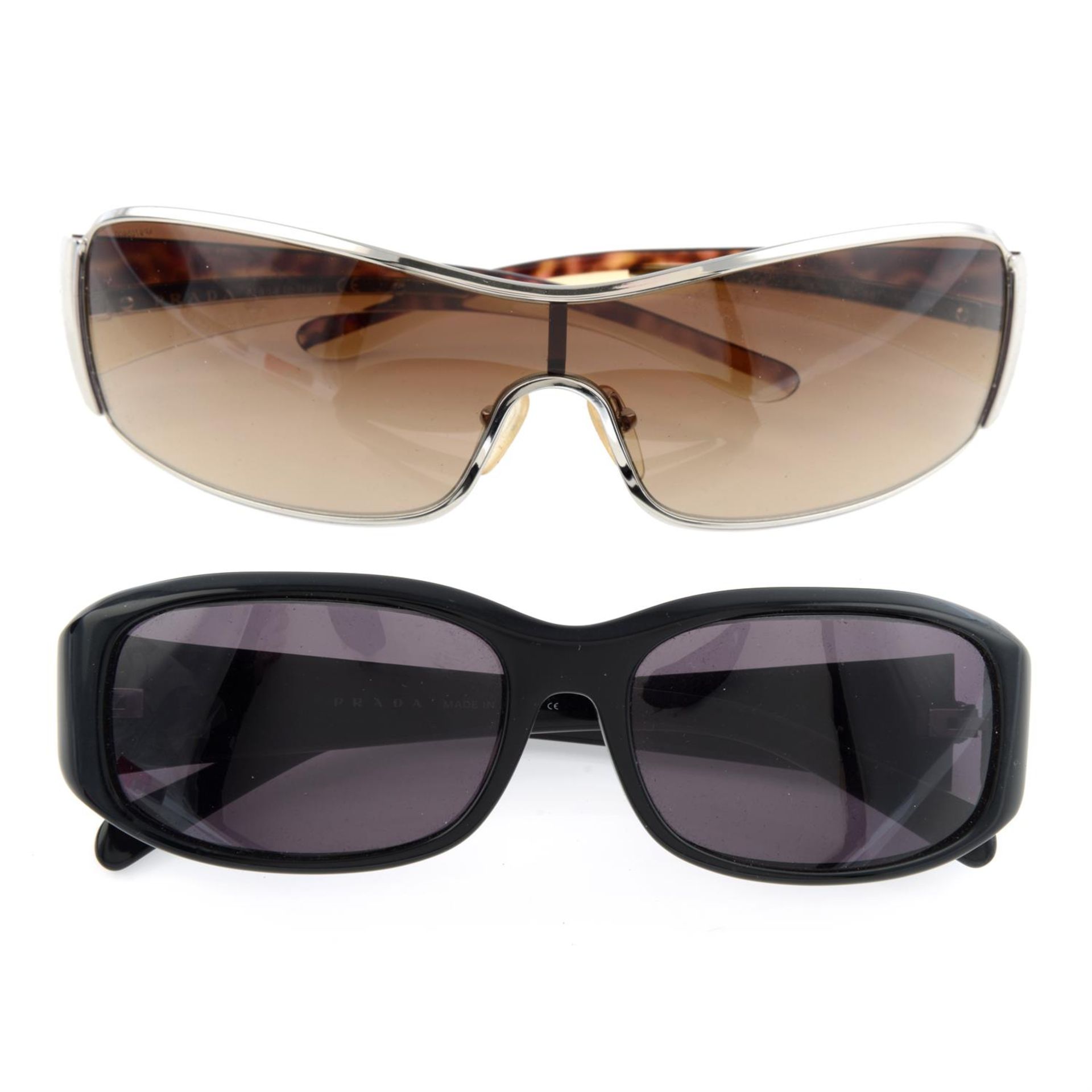 Prada - two pairs of sunglasses.