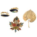 Collection of mixed designers - two brooches and one pair of clip-on earrings.