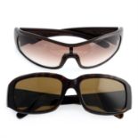 Prada - two pairs of sunglasses.