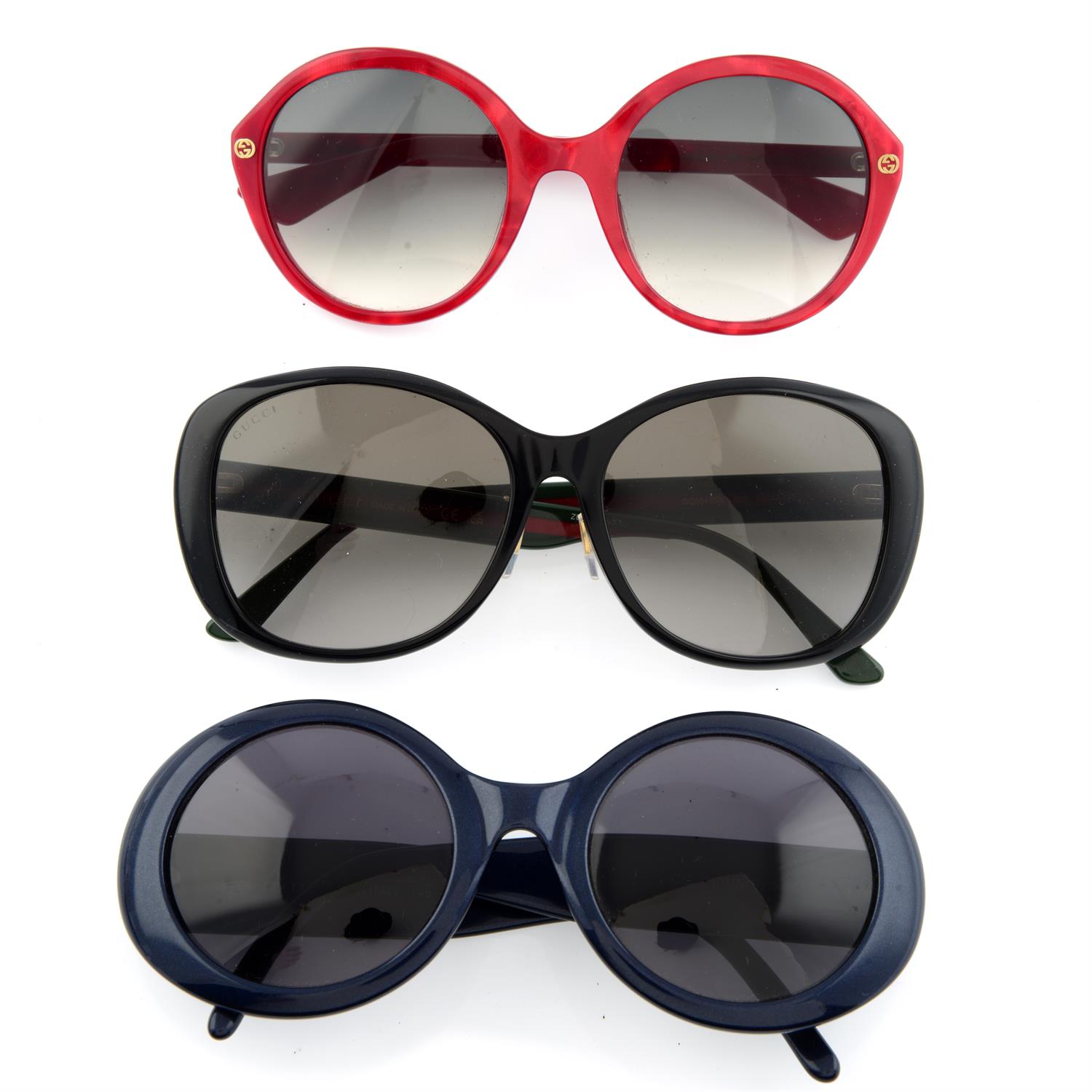 Gucci - three pairs of sunglasses.