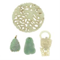 Four carved pendants, to include Jade