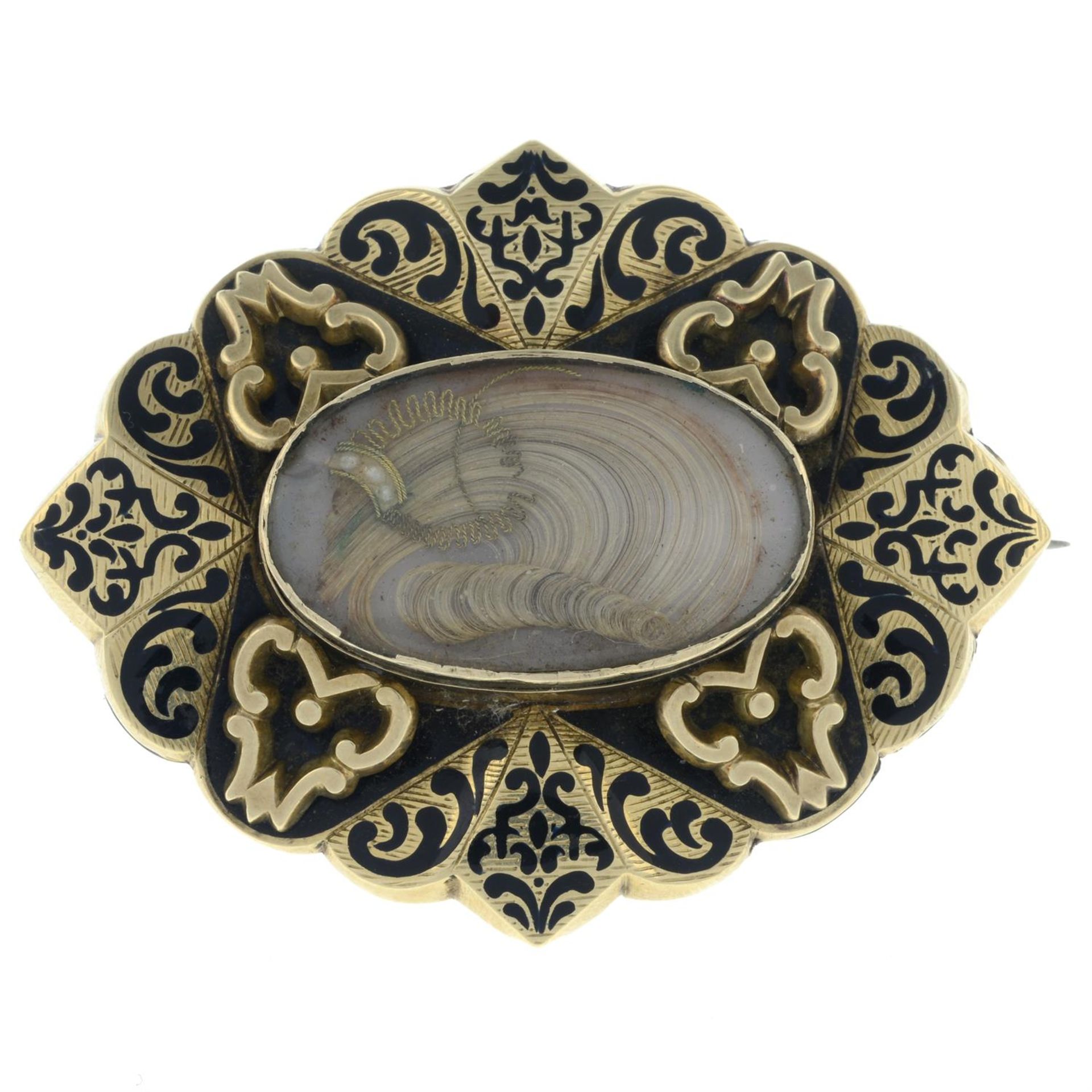 A Victorian enamel mourning brooch, with hairwork panel.