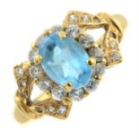 A blue topaz and cubic zirconia cluster ring.