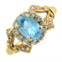 A blue topaz and cubic zirconia cluster ring.