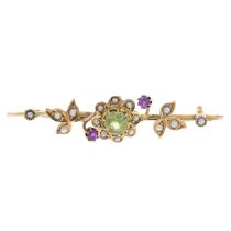 Early 20th gold peridot, ruby & split pearl brooch