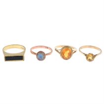 Four gem-set rings.