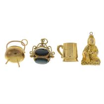 Four variously designed charms