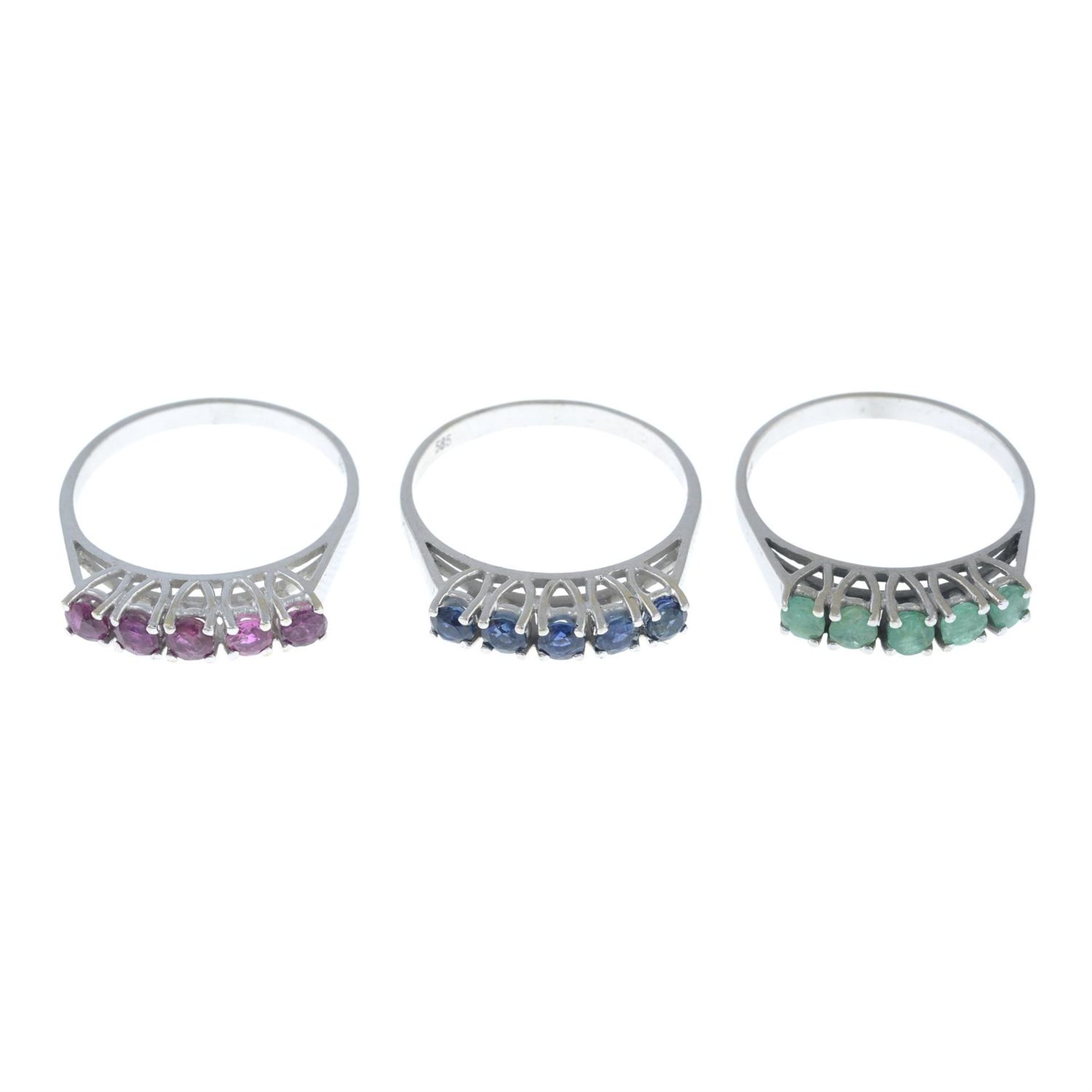 Three gem-set five-stone rings, set with sapphire, ruby and emerald.