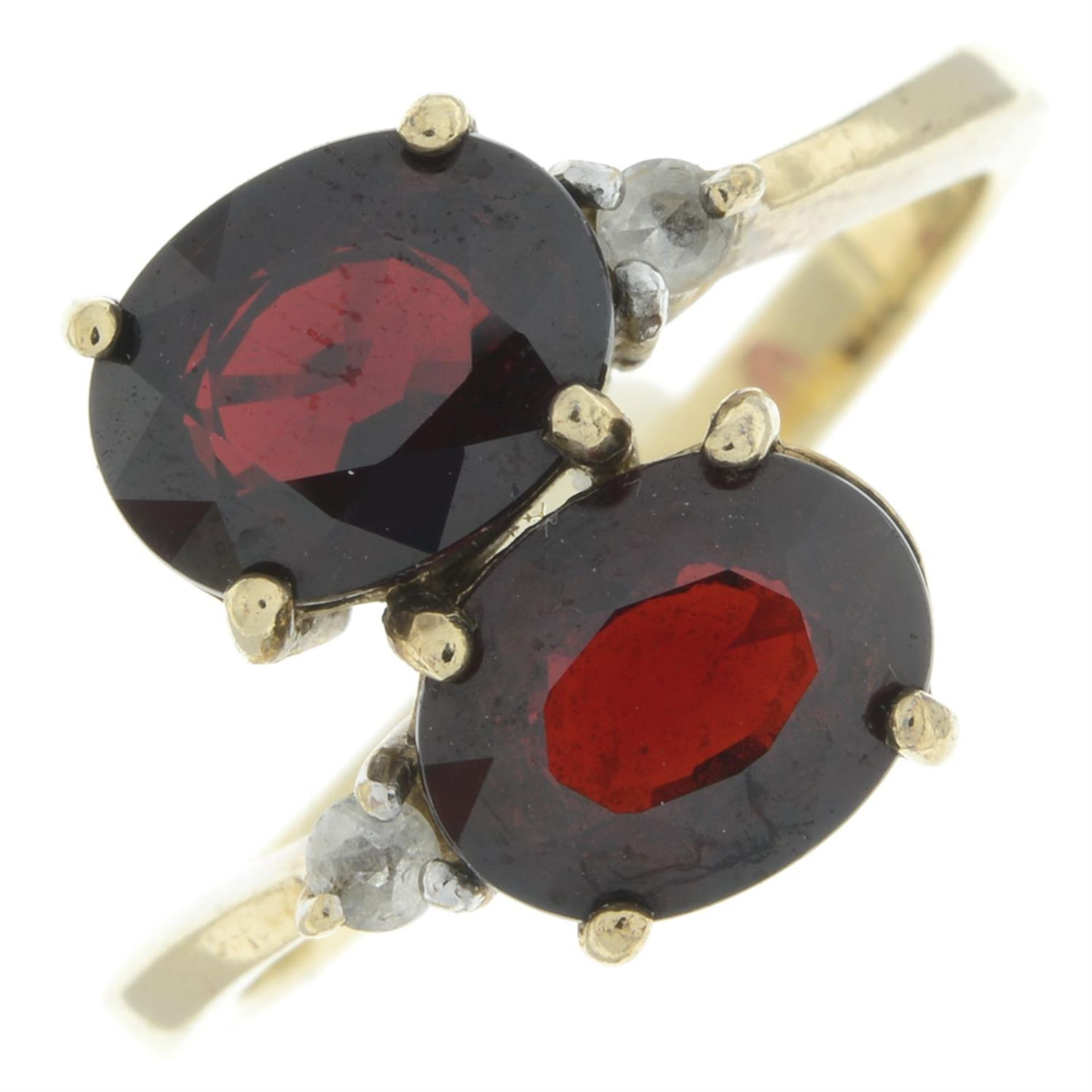 9ct gold garnet two-stone ring, with colourless gem highlight