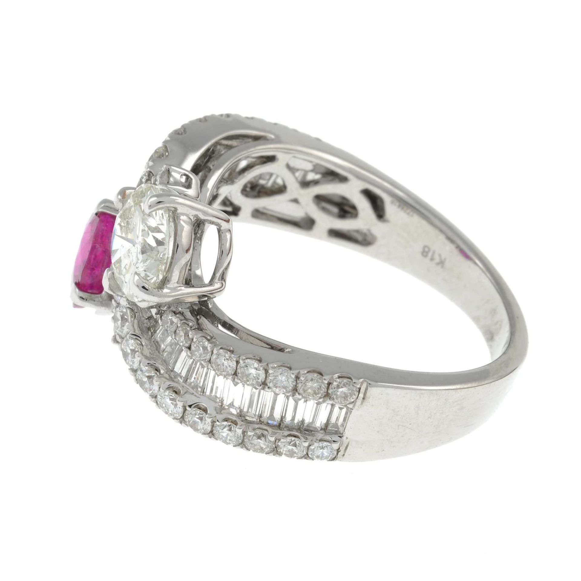 A vari-cut diamond and ruby crossover ring. - Image 3 of 3