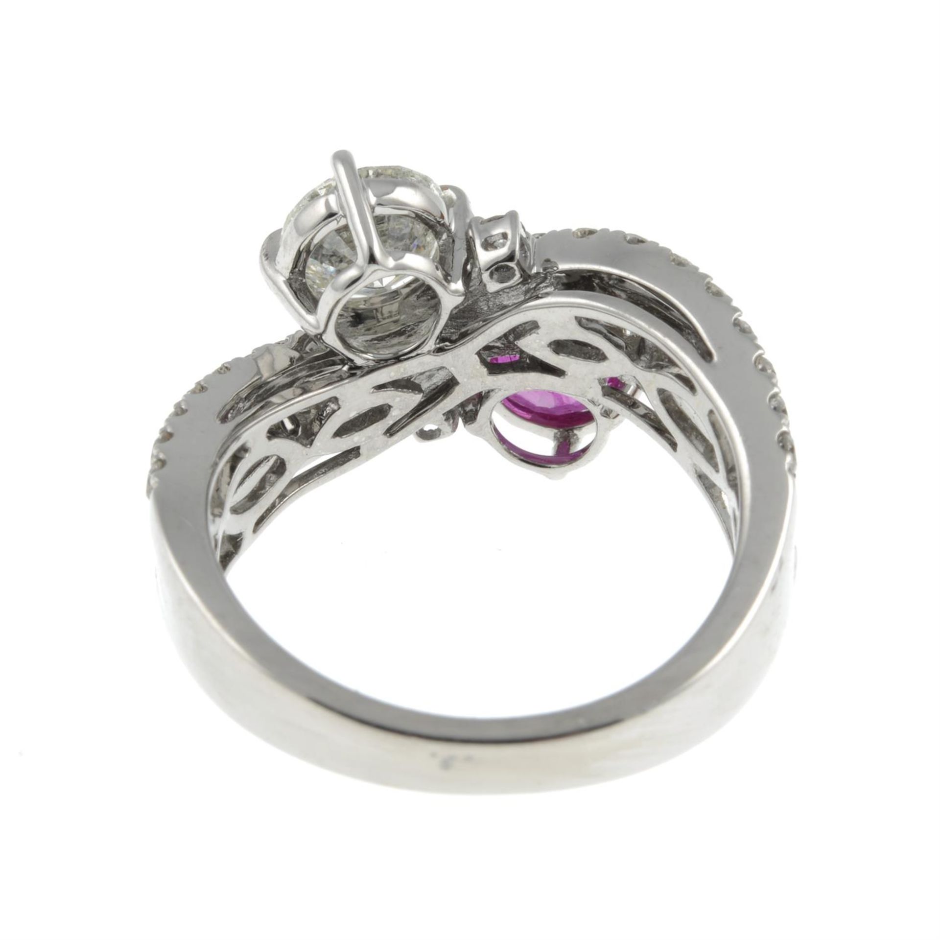 A vari-cut diamond and ruby crossover ring. - Image 2 of 3