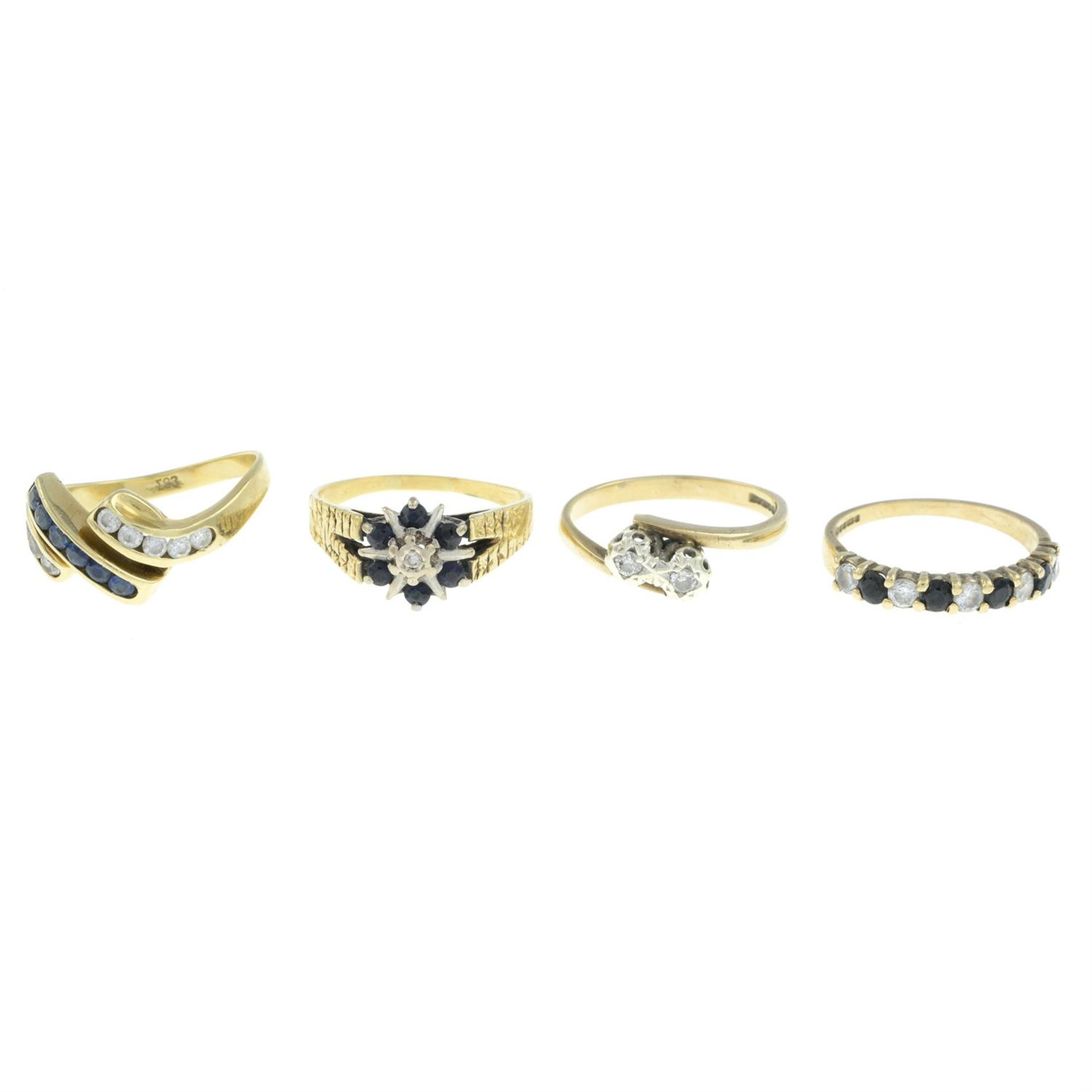 Four gem-set rings.