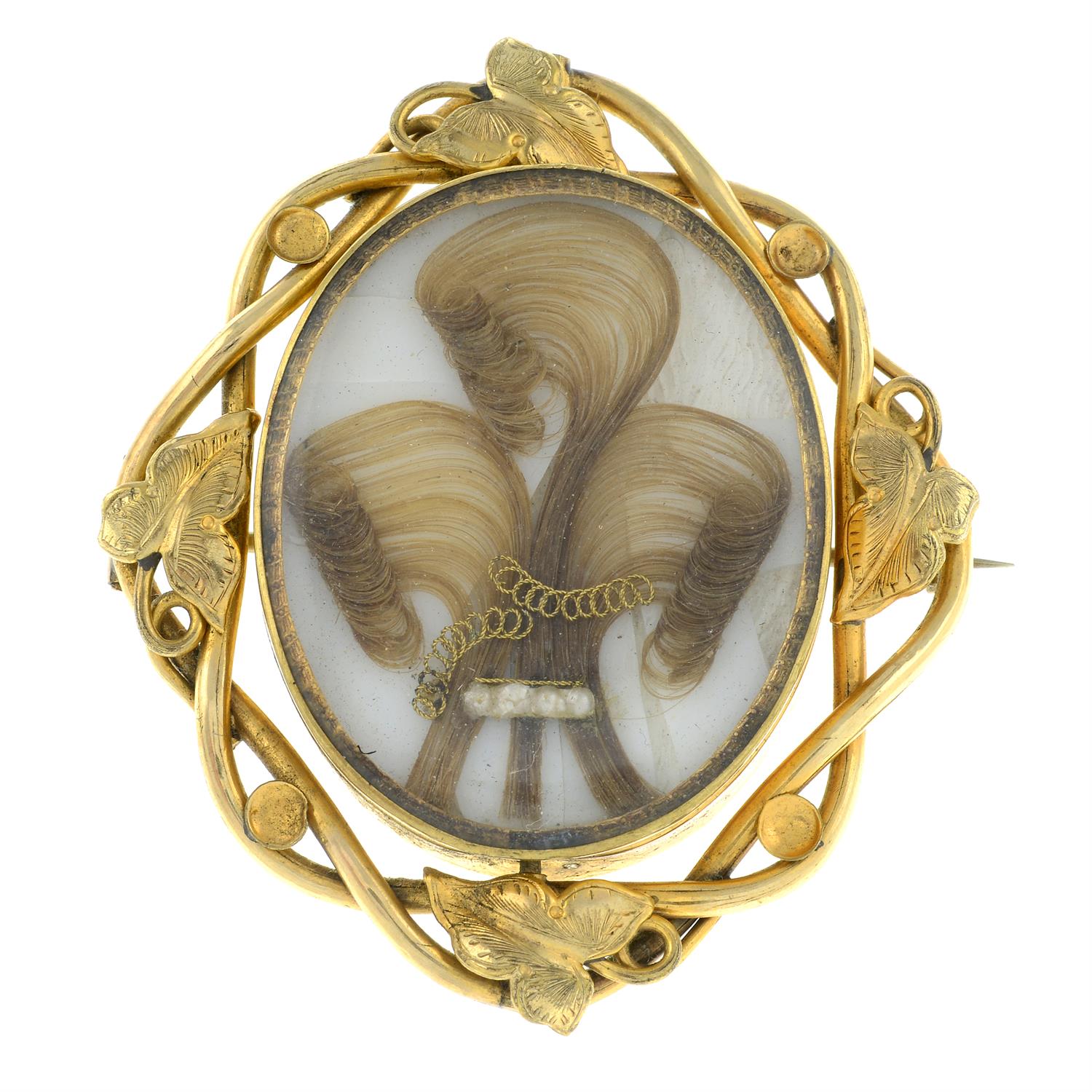 Late 19th century gilted metal hairwork swivel memorial brooch