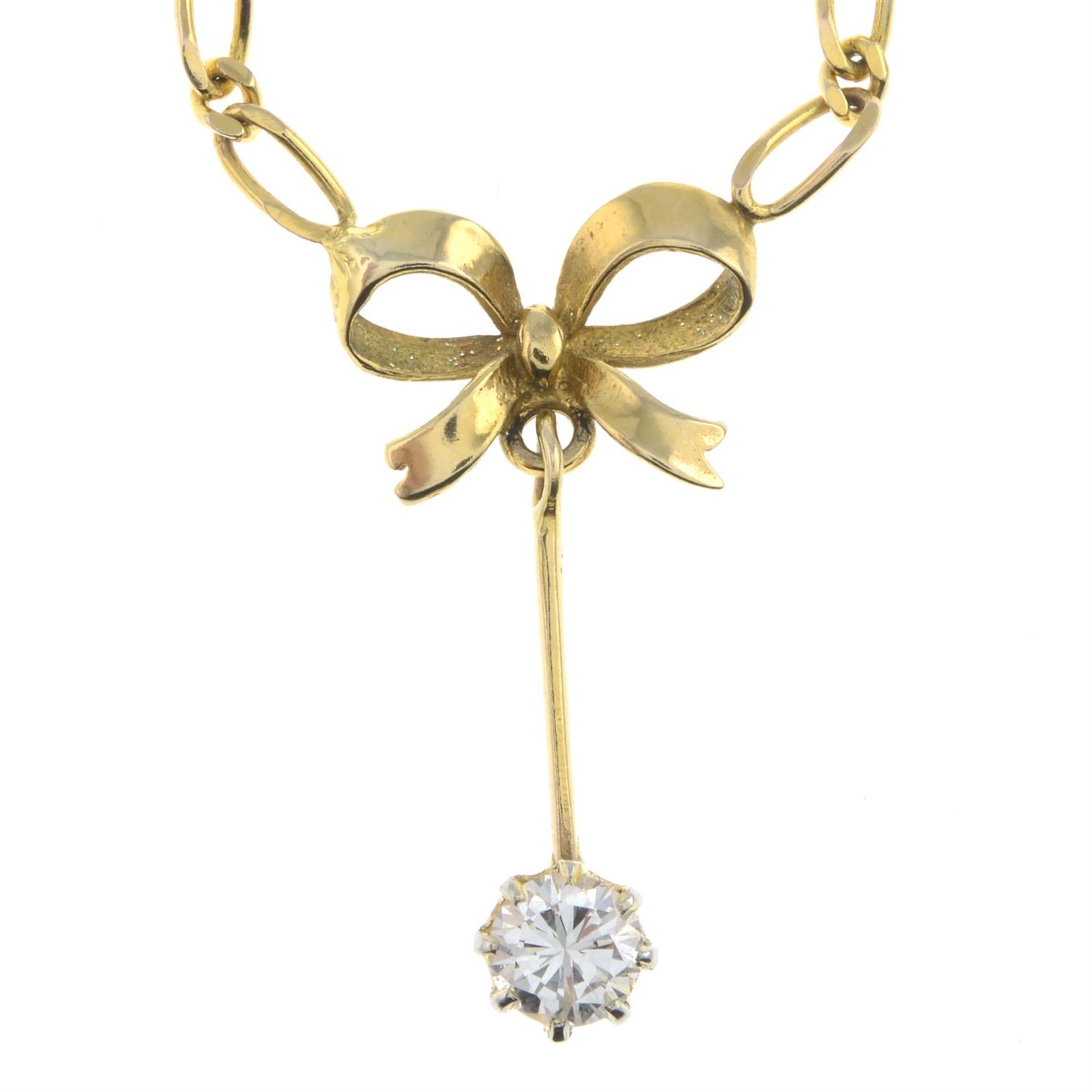 Diamond bow pendant, on chain