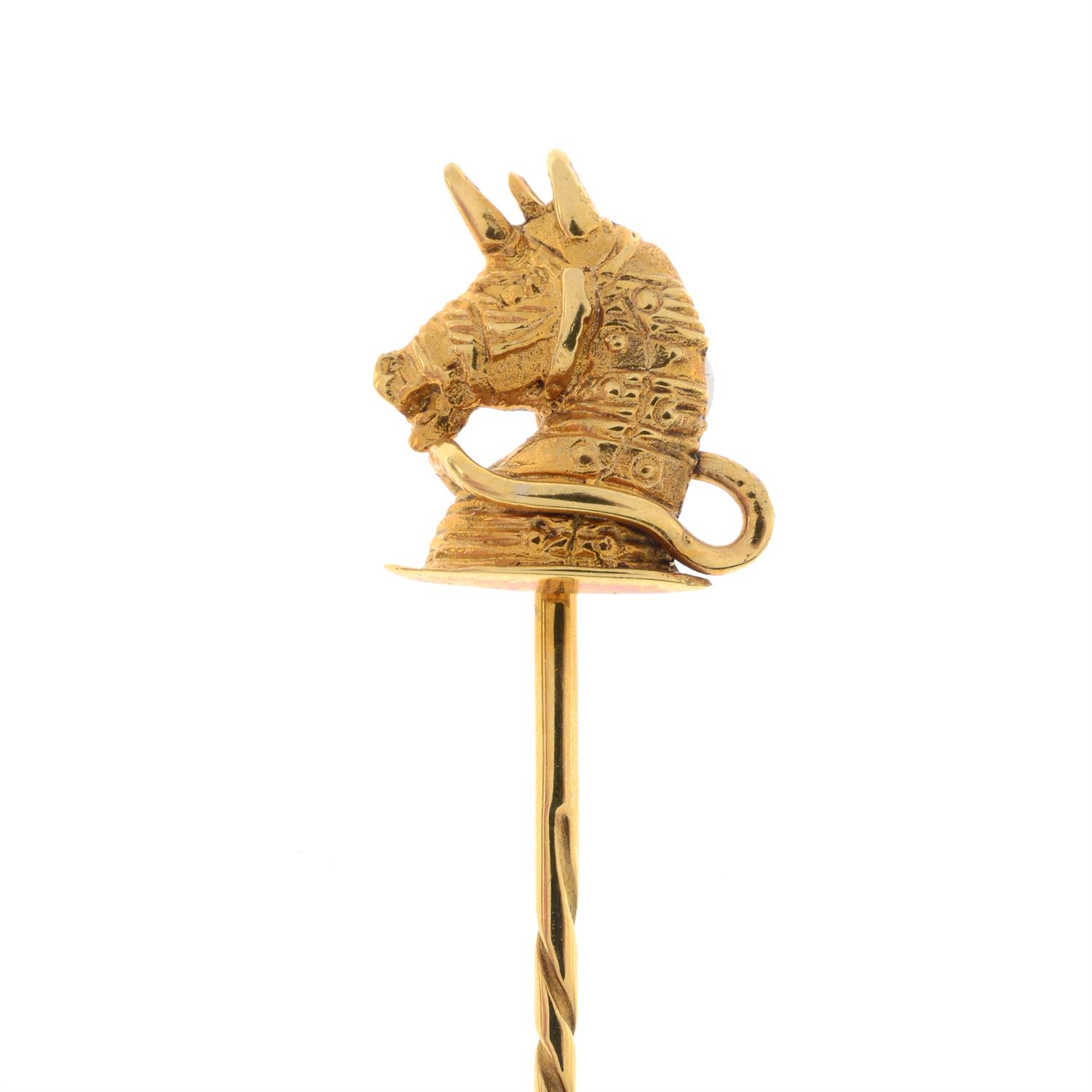A mid 20th century 9ct gold unicorn head stickpin, with Goldsmiths & Silversmiths Co.