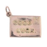 Mid 20th gold 'good luck' envelope charm