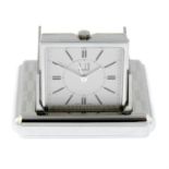 A Captive travel clock by Dunhill, 58mm.