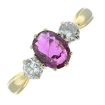 An 18ct gold ruby and brilliant-cut diamond three stone ring.