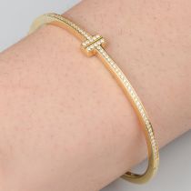 Gold diamond 'Tiffany T' bangle, by Tiffany & Co.