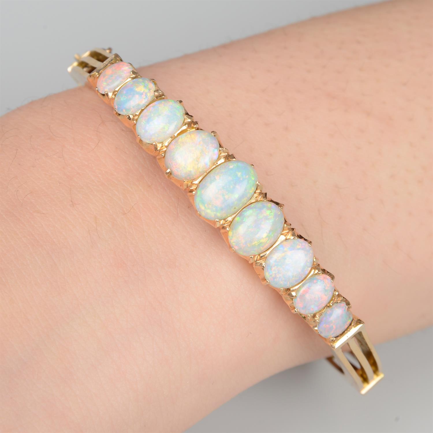 Late 19th century 15ct gold opal hinged bangle