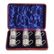 Cased set of late Victorian silver cup holders.