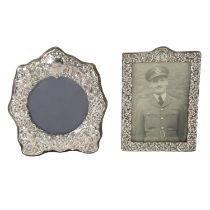 Edwardian silver mounted photograph frame; plus a modern example. (2).