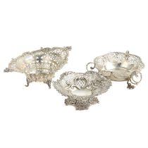 Three pierced silver dishes. (3).