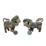 Two white metal Chinese foo dogs