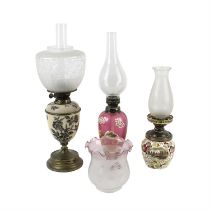 Three early 20th century oil lamps