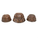 Five copper jelly moulds