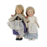 Two linen headed dolls in the manner of Lenci and a collection of vintage games