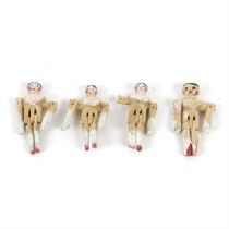 Four miniature articulated dolls