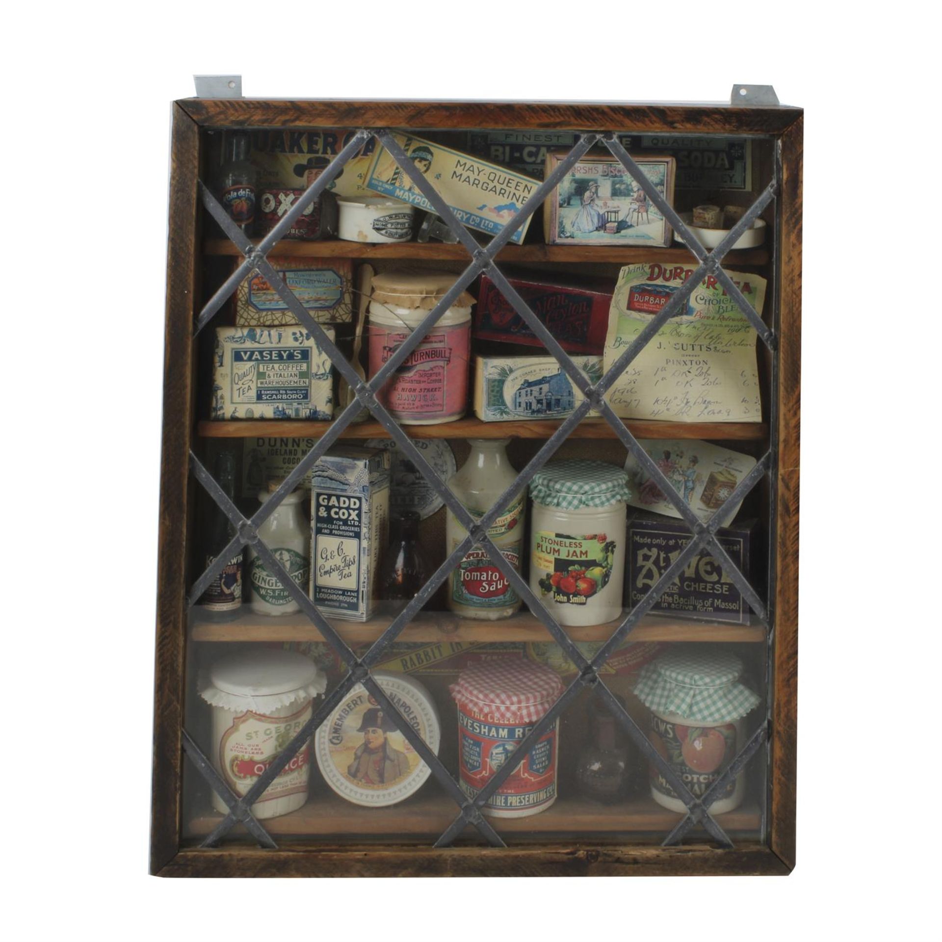 Display cabinet with vintage packaging contents