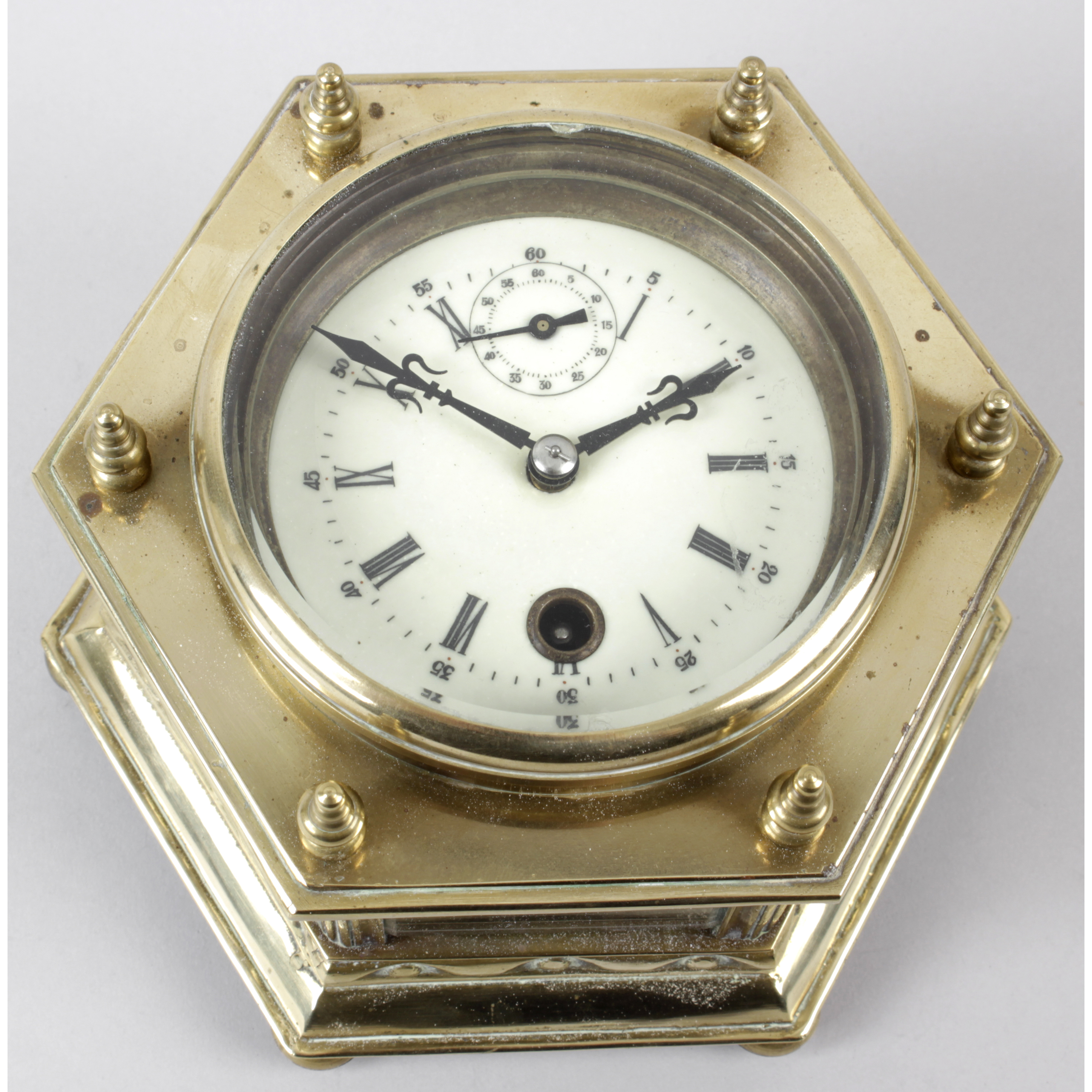 A reproduction brass cased desk clock.