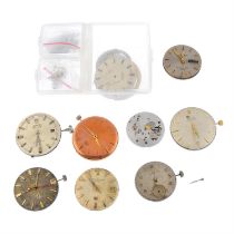 A group of nine watch movements.