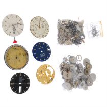 A large group of watch movements and parts.