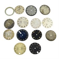 A group of thirteen Omega watch dials.