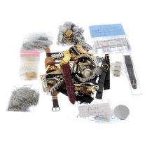 A bag of assorted watch parts.